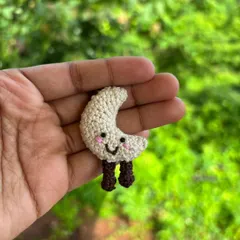 A solo shot of the sweet moon keychain. It's a perfect reminder of a calming presence in your life.