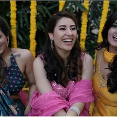 Candid laughter and pure joy. Her makeup looks fresh and radiant even in these unposed, happy moments with her friends.