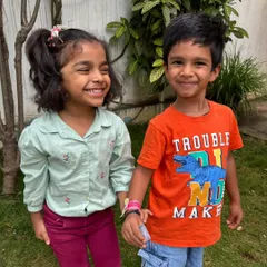 A happy moment between two friends. Our mixed-age environment allows for beautiful friendships to form, where older children mentor younger ones.