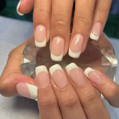 A nail trend that will never go out of style. This is a classic French manicure with a square tip, created using acrylics for a durable and perfectly sculpted look.