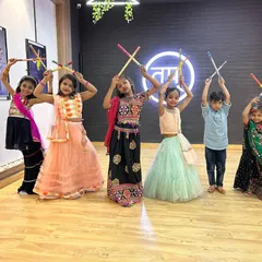 Look at the joy on these faces. This is from our kids' Garba and Dandiya celebration. I love bringing festive energy into the studio, and the kids get to learn traditional dance forms in colorful costumes.