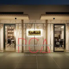 A 3D visualization of the entrance to the Hari Mandir office. The design combines the classic elegance of marble-patterned walls with traditional pillar elements and a warmly lit nameplate, creating a welcoming and divine atmosphere.