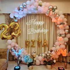 We love personalizing your celebrations. For this 23rd birthday, we used a pastel pink balloon ring backdrop, foil number balloons for the age, and letter balloons to spell out the birthday girl's name.
