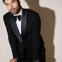 For this formal tuxedo look, the grooming was all about creating a sharp, classic appearance. I focused on defining the model's features and ensuring his hair was perfectly styled to match the elegant outfit.