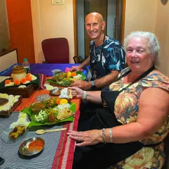 Hosting travellers from around the world is one of my greatest joys. Here, a lovely couple from abroad is enjoying a traditional meal on banana leaves, getting a true taste of Indian hospitality.