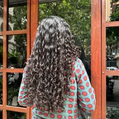 Embracing your greys doesn't mean you can't have fun with them. Here, I've blended natural greys with strategic highlights to create this incredible silver-toned mane that is full of life and definition.