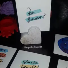 A little reminder to "Be Brave." Our heart polaroid holder, shown here in a white terrazzo finish, is perfect for displaying motivational cards or your favorite photos.
