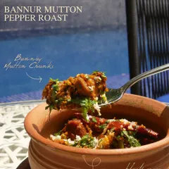 The Bannur Mutton Pepper Roast from our new menu, a spicy and flavorful dish served in a traditional clay pot, showcasing local ingredients.