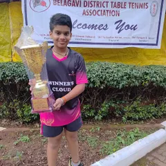 Our young champion Sharvil proudly holds his trophy after winning the Boys Under 11 Singles title at the Karnataka state ranking tournament in Belgaum.