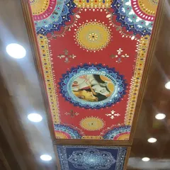 This custom Radha-Krishna Lippan art panel was designed and installed as a ceiling centerpiece. The vibrant colors and detailed mirror work create a stunning focal point, demonstrating how we can transform a simple ceiling into a work of art for your home.