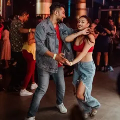 Caught in the moment during a social. This is where all the practice pays off, on a packed dance floor, just connecting with your partner and the music. This is the community we are building.