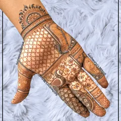 A stylish back-hand design with a mix of checks, floral patterns, and an elephant motif. It's a modern take on traditional elements.