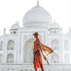 A high-key lifestyle portrait using the morning haze at the Taj Mahal. This style creates a soft, ethereal look that feels both timeless and modern.