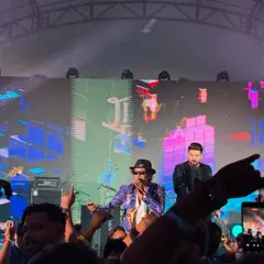On stage during our first show in Singapore. The production was massive, with a huge LED screen and amazing lights, creating a full concert atmosphere for the corporate audience.