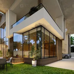 Another perspective of the Coimbatore villa, showing the seamless integration of indoor and outdoor spaces. The design incorporates a landscaped garden with a seating area that connects directly to the interior through floor-to-ceiling glass.
