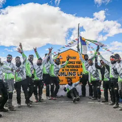 Standing on top of the world at 19,300 ft. This is our crew of 14 riders after conquering Umling La in Ladakh, the planet's highest motorable road. This is the kind of epic journey and achievement that defines the spirit of BMR.