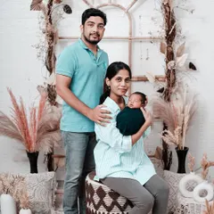 The first official family portrait. This photo shows the new parents with their swaddled newborn in our rustic-themed studio, featuring a beautiful arch decorated with pampas grass. We offer various backdrops to match your style.