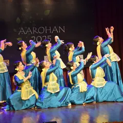Our senior students in beautiful blue and yellow costumes during their performance at Aarohan 2025, an event personally directed by Guru Shinjini Kulkarni.