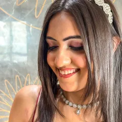 A close-up of the party makeup, featuring a soft smokey eye and a radiant complexion. This look is perfect for any celebration.