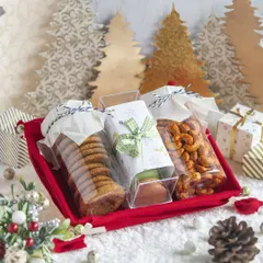 My Christmas hampers bring festive cheer with a delicious assortment of treats. This tray includes my popular cookies, flavored nuts, and other baked goods, perfect for sharing during the holiday season.