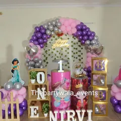 A lovely princess theme with wooden "ONE" blocks and "BABY" boxes. The mix of purple, pink, and silver balloons with princess cutouts is perfect for a first birthday celebration.