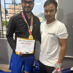 One of our boxers with his coach after winning a gold medal. This partnership between fighter and coach is the key to success in the ring.