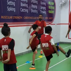 Leg kicks and dynamic stretches are a core part of our warm-up routine. These movements improve flexibility and prepare young athletes for more intensive running and jumping activities.