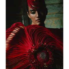 A close-up portrait from the same look for Vaishali S. This angle highlights the intricate threadwork at the center of the 'flower' and the structured headpiece that completes the avant-garde styling.