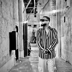 A quick pitstop in Doha for my first international show. I flew in, conquered the stage, and raved out. This black and white shot captures the vibe of exploring the city's old alleys.