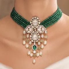 A magnificent choker from the Emrosia collection, featuring a multi-strand emerald bead necklace with a stunning polki and pearl pendant.
