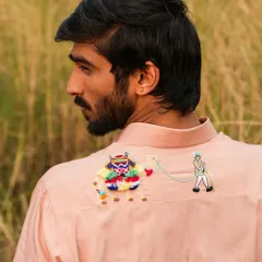 A close-up of the 3D camel embroidery on the back of our 'Desert Survivor' shirt. This intricate detail narrates tales of travel and adventure, making the garment truly unique.