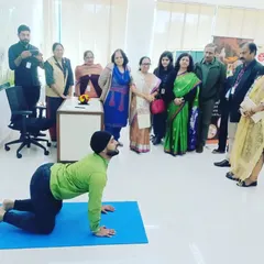 I was invited to lead a yoga therapy session at NTPC, where we focused on poses to counteract the effects of long hours spent sitting at a desk. Here, I'm demonstrating the Cat-Cow stretch, a simple yet effective movement for improving spinal flexibility and relieving back tension for corporate employees.
