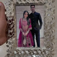 This silver antique photo frame adds a touch of vintage luxury to any space. The detailed, leafy metalwork beautifully encases your cherished photo, making it an unforgettable gift for a special couple.