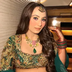 This shot highlights the complete look, including the beautiful henna, colourful bangles, and vibrant makeup.