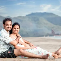 A relaxed and happy portrait of a couple enjoying their time on the sand. This kind of comfortable, smiling shot is perfect for capturing the easy-going love they share.