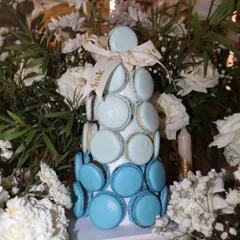 Elevate your dessert table with our stunning eggless macaron tower. This one features an ombré blue design and makes for a beautiful and delicious centerpiece at any event.