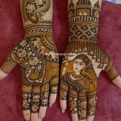I specialize in creating custom portrait mehandi. Here, I designed a beautiful bride's portrait on the palm, surrounded by delicate details like hanging bells (jhumars), making the henna art truly personal and unique.