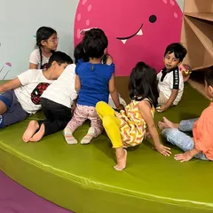 The children gather in one of our cozy corners for a story session about Ganesha. It's a time for learning, listening, and making friends.