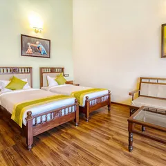 A similar view of our twin room, showcasing the ample space and amenities like a television and desk, ensuring a comfortable long-term stay.