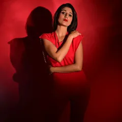 For this high-fashion shoot, I created a powerful monochromatic look with a classic red lip and sharp, clean skin. This style of editorial makeup is about making a bold statement and ensuring the model's confidence shines through.