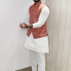 Another view of the coral floral Nehru jacket and white kurta set, highlighting the versatility of this ensemble.