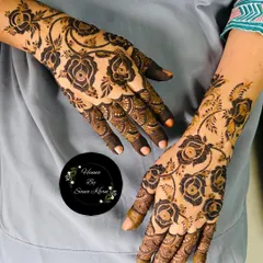A classic rose vine design, perfect for party guests. The pattern is asymmetrical, flowing naturally across the back of both hands for an elegant and cohesive look.