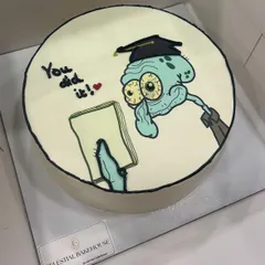 Celebrate with a smile. We love bringing your favorite characters and inside jokes to life with our hand-drawn doodle cakes, like this fun Squidward design for a graduation. It's all done in buttercream for maximum flavor.