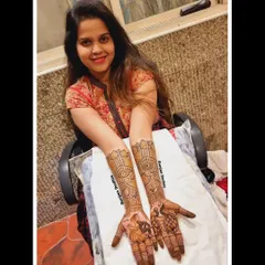 My lovely client Ravina, all smiles with her full engagement mehendi. The design features a couple portrait and beautiful peacock motifs.