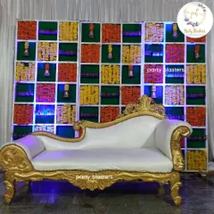 My signature floral grid backdrop is perfect for a traditional baby shower or Seemantham. Here, I've used a vibrant mix of marigolds and tuberoses, accented with hanging temple bells, and paired it with a classic golden and white chaise lounge for the mother-to-be.