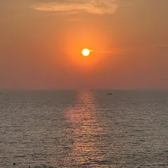 It's not all mountains. We also chase sunsets over the ocean. Imagine ending your day with this breathtaking view on our Gokarna beach trip. Salty air, golden skies, and good company.