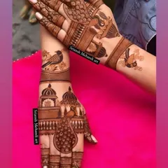 A beautiful example of non-portrait bridal art. This design uses majestic peacocks and graceful birds set against traditional Indian architecture to create a sophisticated and timeless look.