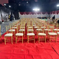 We arranged the seating for a large outdoor corporate event on a plush red carpet. This image shows the scale of our operations, ensuring every guest has a comfortable seat for the main function.