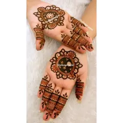 A minimal design perfect for Karwa Chauth or any festival. Each hand has a different central mandala, one with a lotus and one with a simple geometric pattern, showing that simple can still be beautiful.