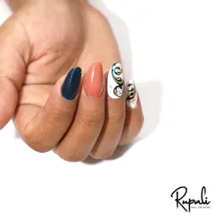 This client wanted something unique, so we did a set of extensions with a mix of solid colors and intricate swirl art with gold foil.